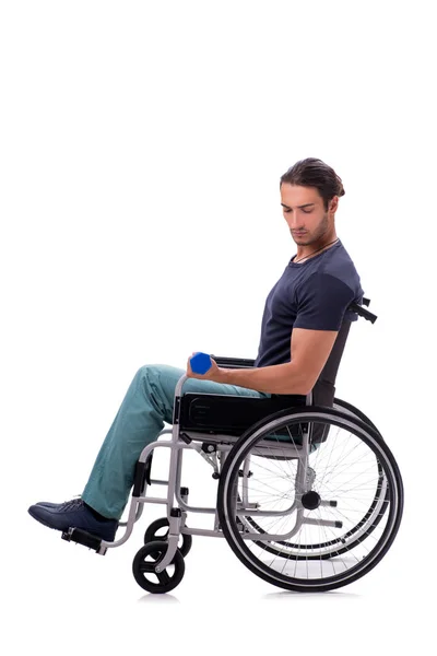 Young disabled man doing physical exercises isolated on white — ストック写真