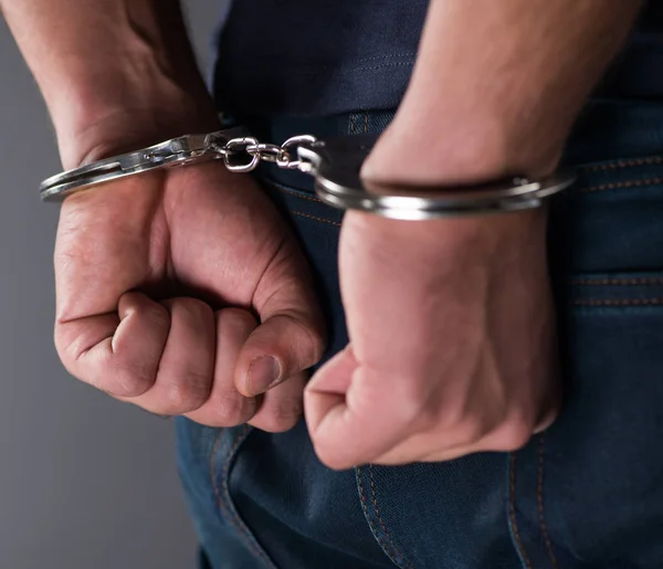 Man with his hands handcuffed in criminal concept — Stock Photo, Image