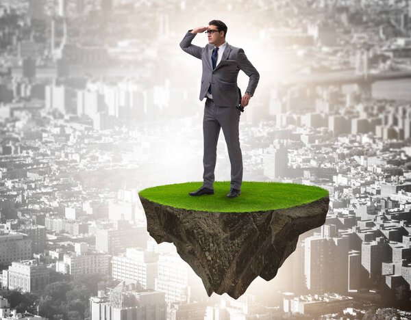 Businessman on flying island looking into future