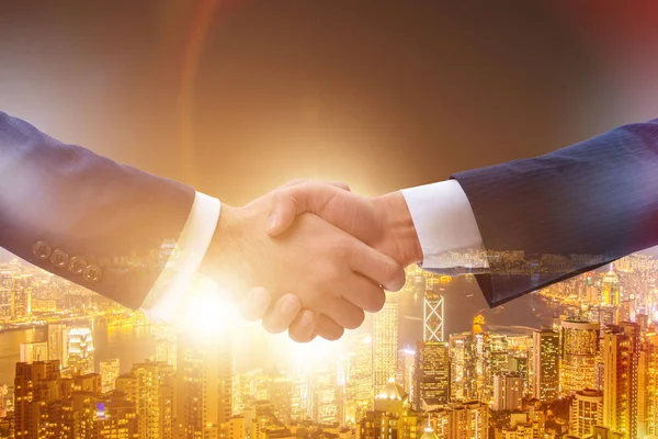 Businessman shaking hands in agreement — Stock Photo, Image