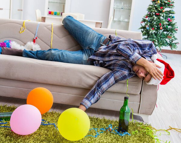 Man having hangover after christmas party