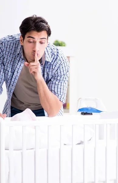 The young dad looking after newborn baby