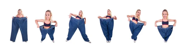 Woman in dieting concept with big jeans — Stock Photo, Image