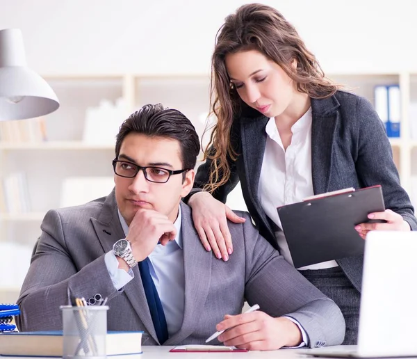 The sexual harassment concept with man and woman in office — Stock Photo, Image