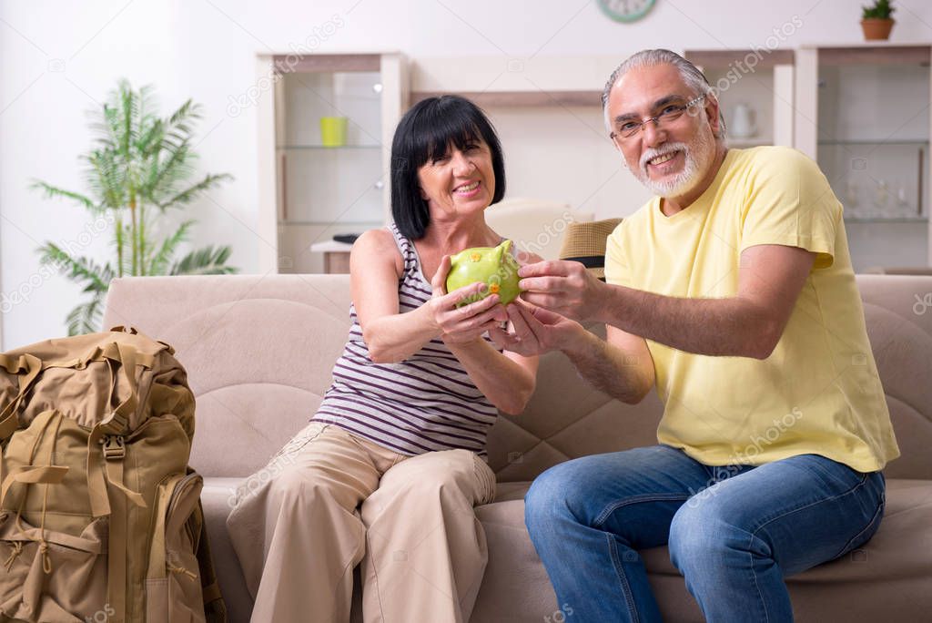 Old couple preparing for vacation travel