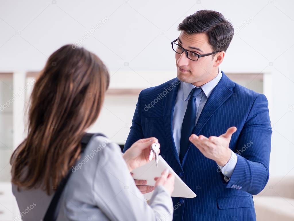 Real estate agent showing new apartment to owner