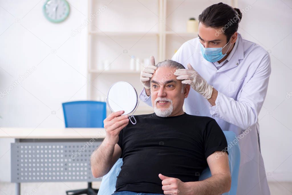 Old man visiting young doctor for plastic surgery