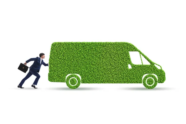 Geschäftsmann mit grünem Ökofahrzeug — Stockfoto