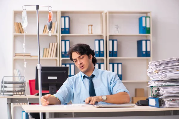 Young male employee in blood transfusion concept — Stock Photo, Image