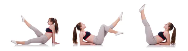 Young female doing exercises on white — Stock Photo, Image