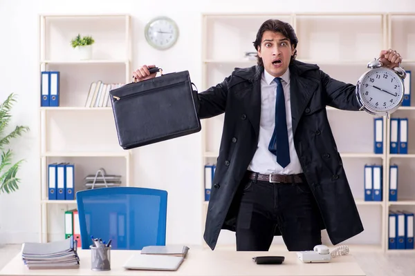 Young male employee in the office in time management concept — Stock Photo, Image