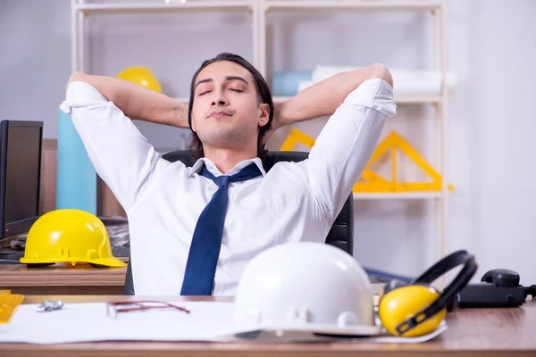 Young male architect working in the office — Stock Photo, Image