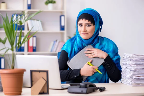 Female employee in hijab working in the office