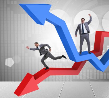 Büyüme ve gerileme grafikleriyle iş adamı