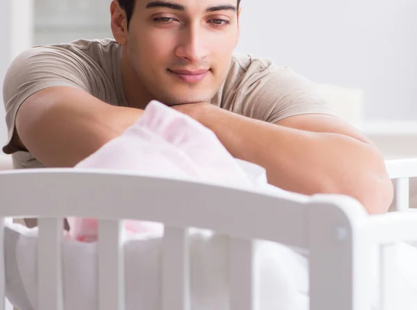 Young father enjoying time with newborn baby at home — Stock Photo, Image