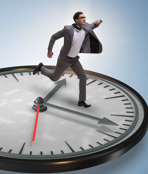 Businessman in time management concept — Stock Photo, Image