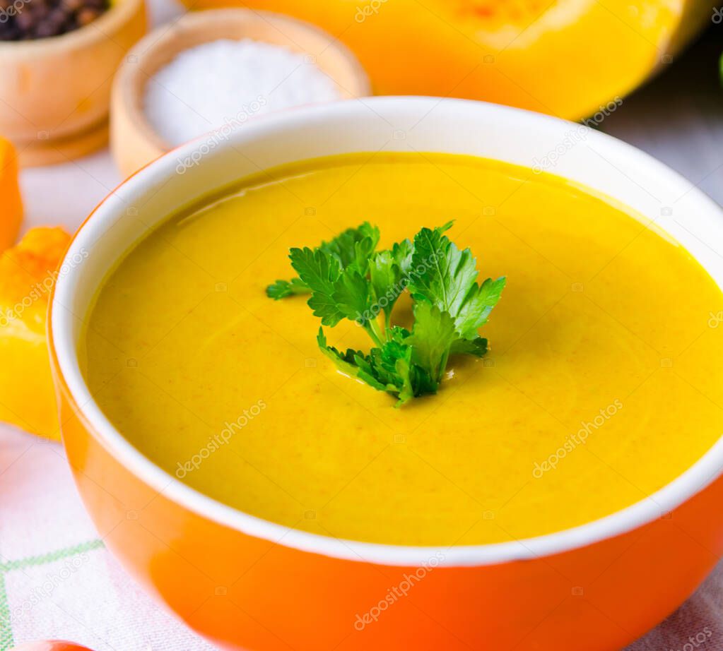 Pumpkin soup served on the table in bowl