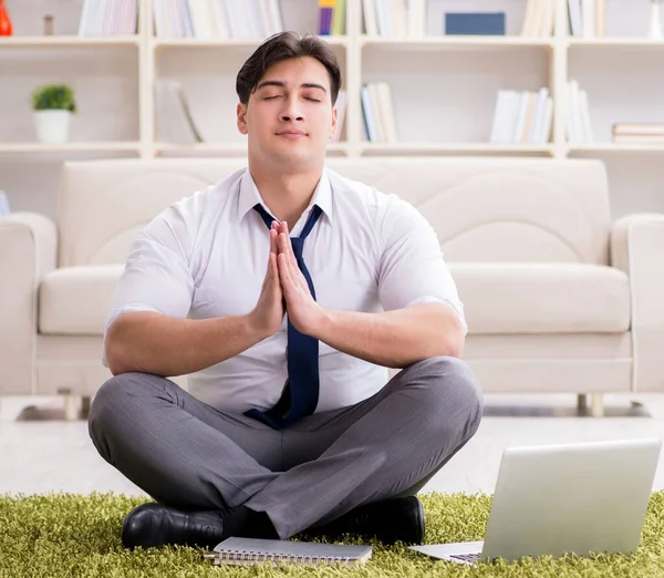 Businessman sitting on the floor in office — Stock Photo, Image