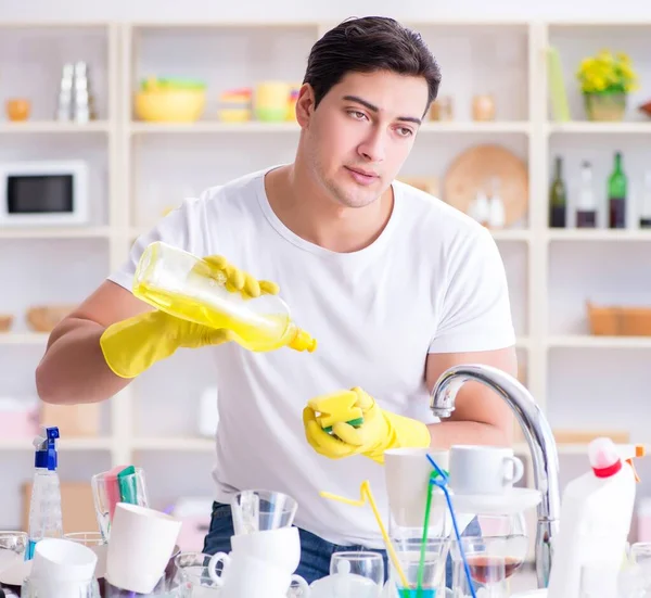 Man frustrated at having to wash dishes — Stock Photo, Image