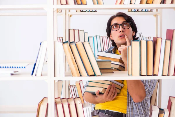 Male student preparing for exams at library — Stock Photo, Image