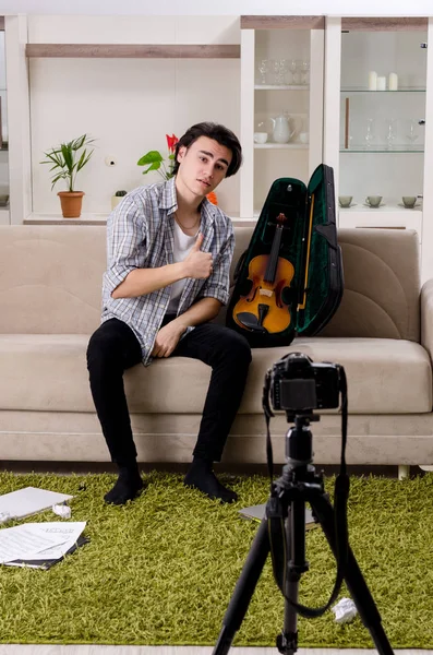 Young male blogger playing violin at home — Stock Photo, Image