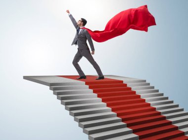 Süper kahraman işadamı kırmızı halı merdivenlerine tırmanıyor