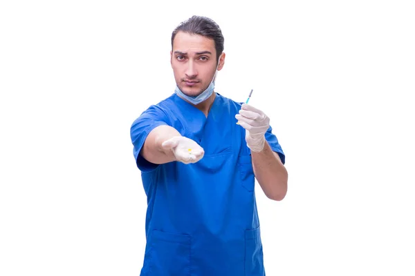 Młody przystojny lekarz ze strzykawką na białym — Zdjęcie stockowe