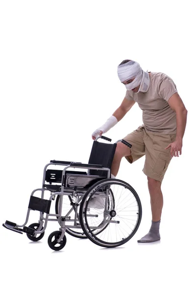 Injured man in wheel-chair isolated on white — Stock Photo, Image