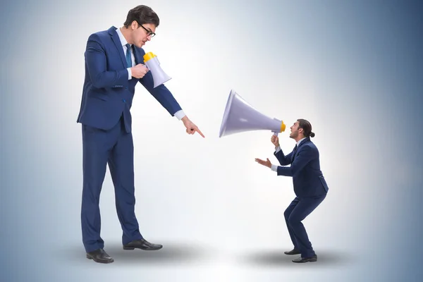 Businessman shouting through large loudspeaker — ストック写真