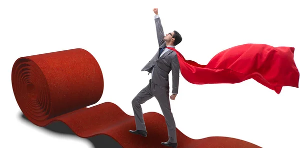 Super-herói no tapete vermelho no conceito de sucesso — Fotografia de Stock