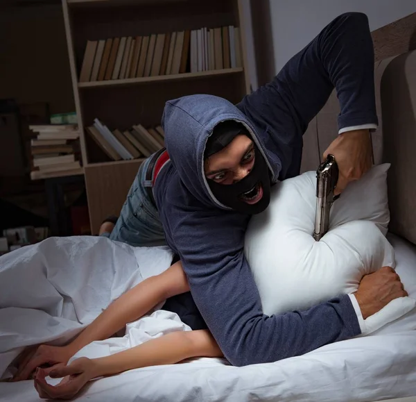 Burglar breaking into house at night to bedroom with sleeping wo — Stock Photo, Image