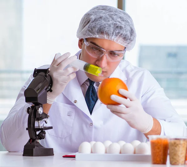 Nutrition expert testing food products in lab Stock Picture