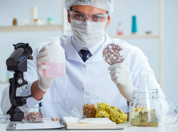 Chemist mixing perfumes in the lab