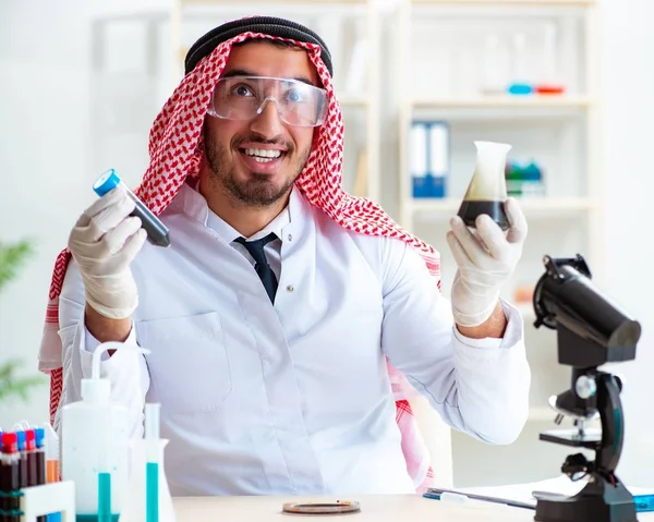 Arab chemist scientist testing quality of oil petrol — Stock Photo, Image