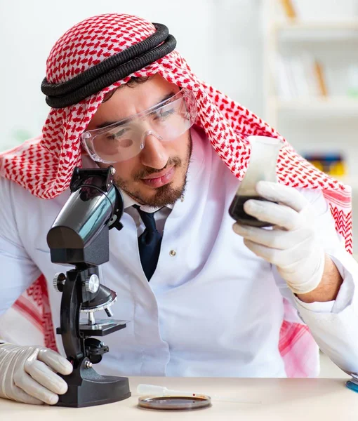 Arab chemist scientist testing quality of oil petrol — Stock Photo, Image