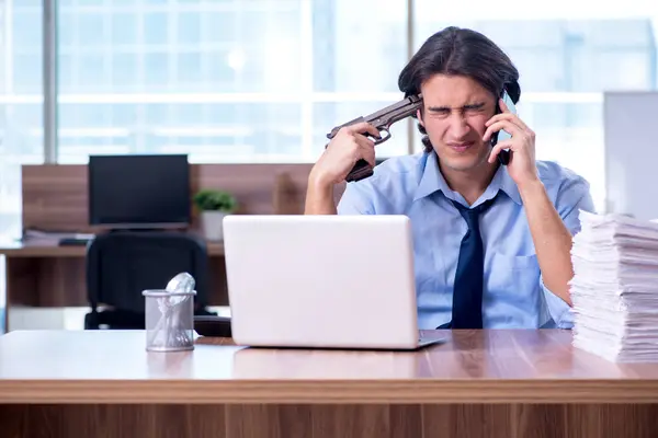 Young employee unhappy with excessive work — Stock Photo, Image