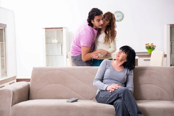 Young family and mother-in-law in family issues concept — Stock Photo, Image