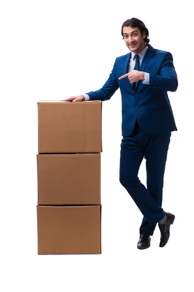 Mladý muž zaměstnanec s krabicemi izolované na bílém — Stock fotografie