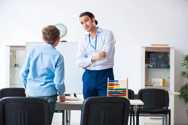 Young father helping his son to prepare for exam — Stock Photo, Image