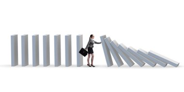 Businesswoman preventing domino effect in business concept clipart