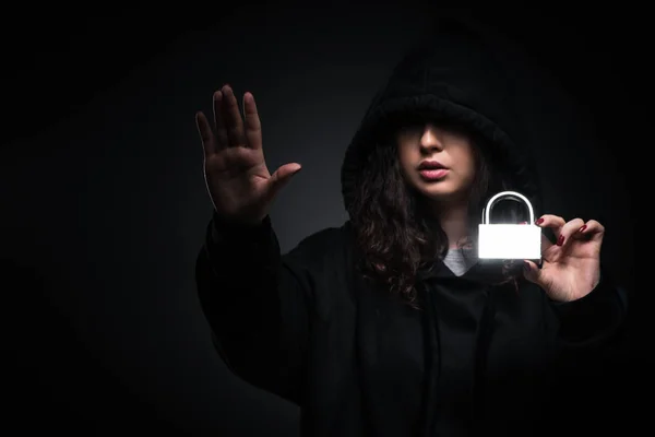 Female hacker hacking security firewall late in office