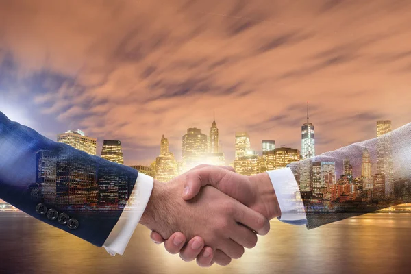 Businessman shaking hands in agreement — Stock Photo, Image