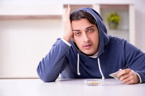 Young man having problems with narcotics at home — Stock Photo, Image