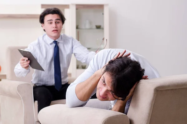 Young male patient discussing with psychologist personal problem — Stock Photo, Image