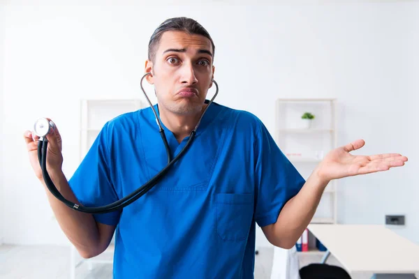 Young male doctor working in the clinic — Stock Photo, Image