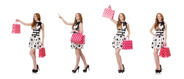 Mladá žena s nákupní tašky na bílém — Stock fotografie