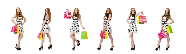 Young woman with shopping bags on white — Stock Photo, Image