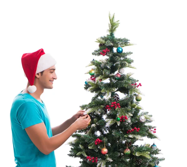 Jongeman versieren kerstboom geïsoleerd op wit — Stockfoto