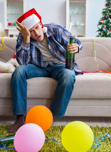 Man having hangover after christmas party