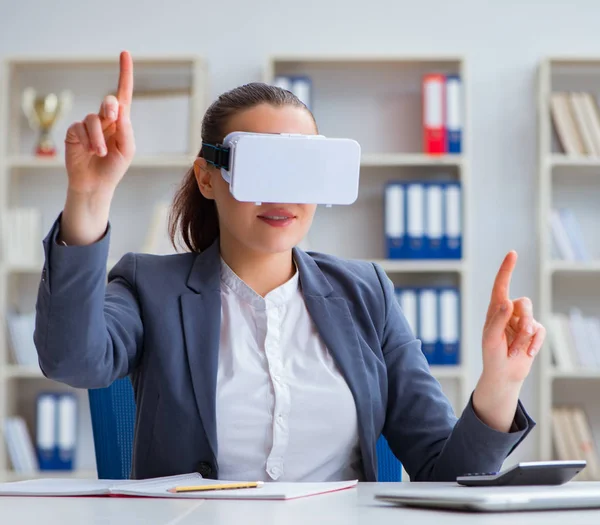 Businesswoman with virtual reality glasses in office — Stock Photo, Image